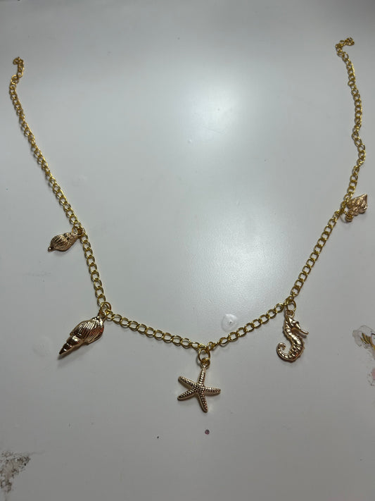 Gold Ocean Charm Necklace – Starfish, Shell & Seahorse Accents
